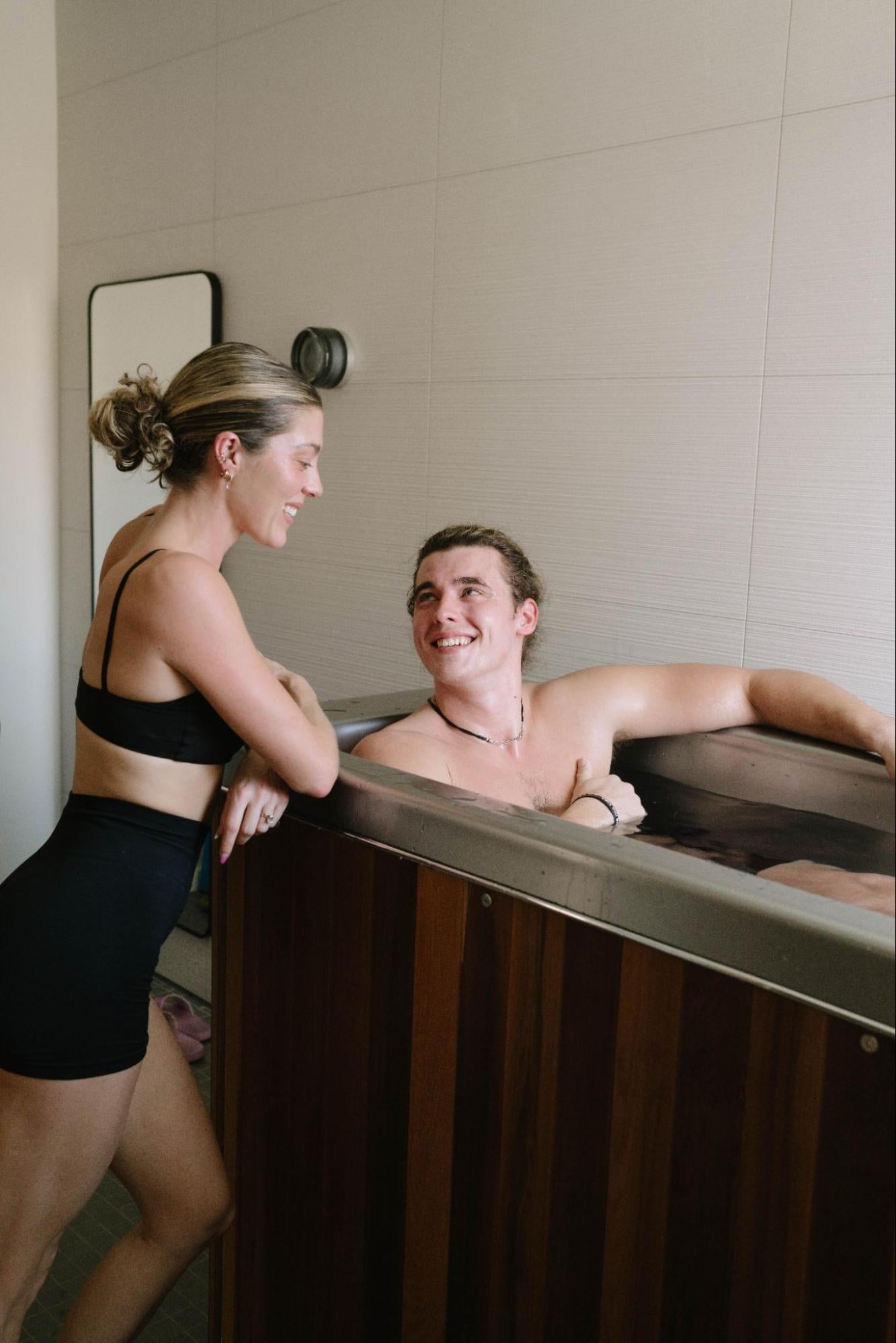 Two people enjoying a cold plunge from ColdTub as part of their fitness routine, highlighting the benefits of cold plunge before or after workout